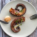Fish restaurant Grilled octopus on plate