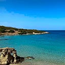 Voulisma Beach with turquoise waters and sandy shoreline under a clear blue sky Voulisma Beach – Crystal Waters and Golden Sands in Crete